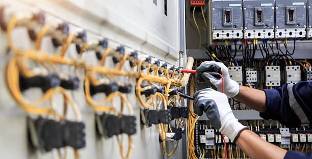 Professional Electrician technician working in Newton, MA